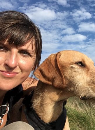 Reflexologist Lucy Evans with her dog